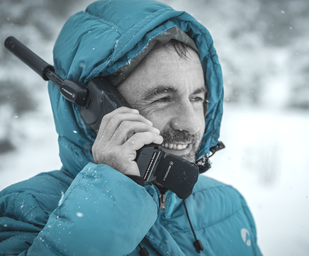 person-snow-cold-winter-satellite-phone-call-help